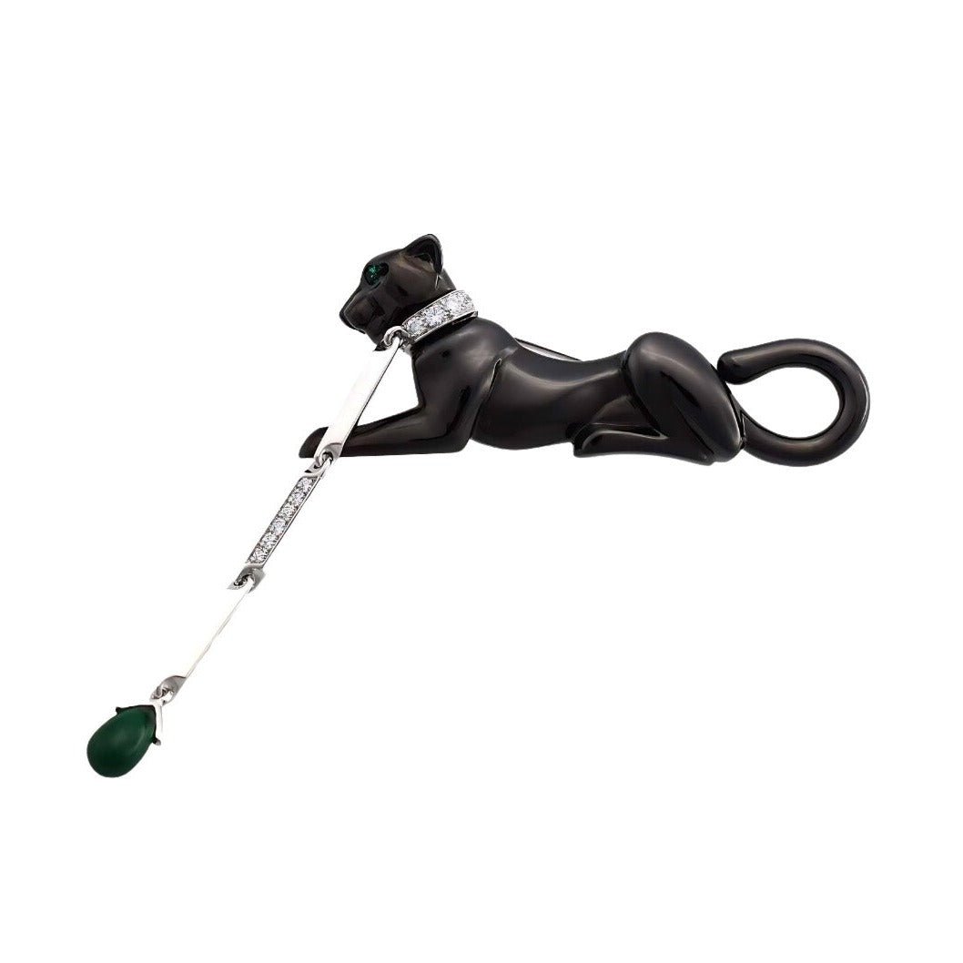 CARTIER Panthère pin brooch in white gold, emeralds and diamonds