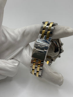 Montre Breitling Chronomat en or et acier