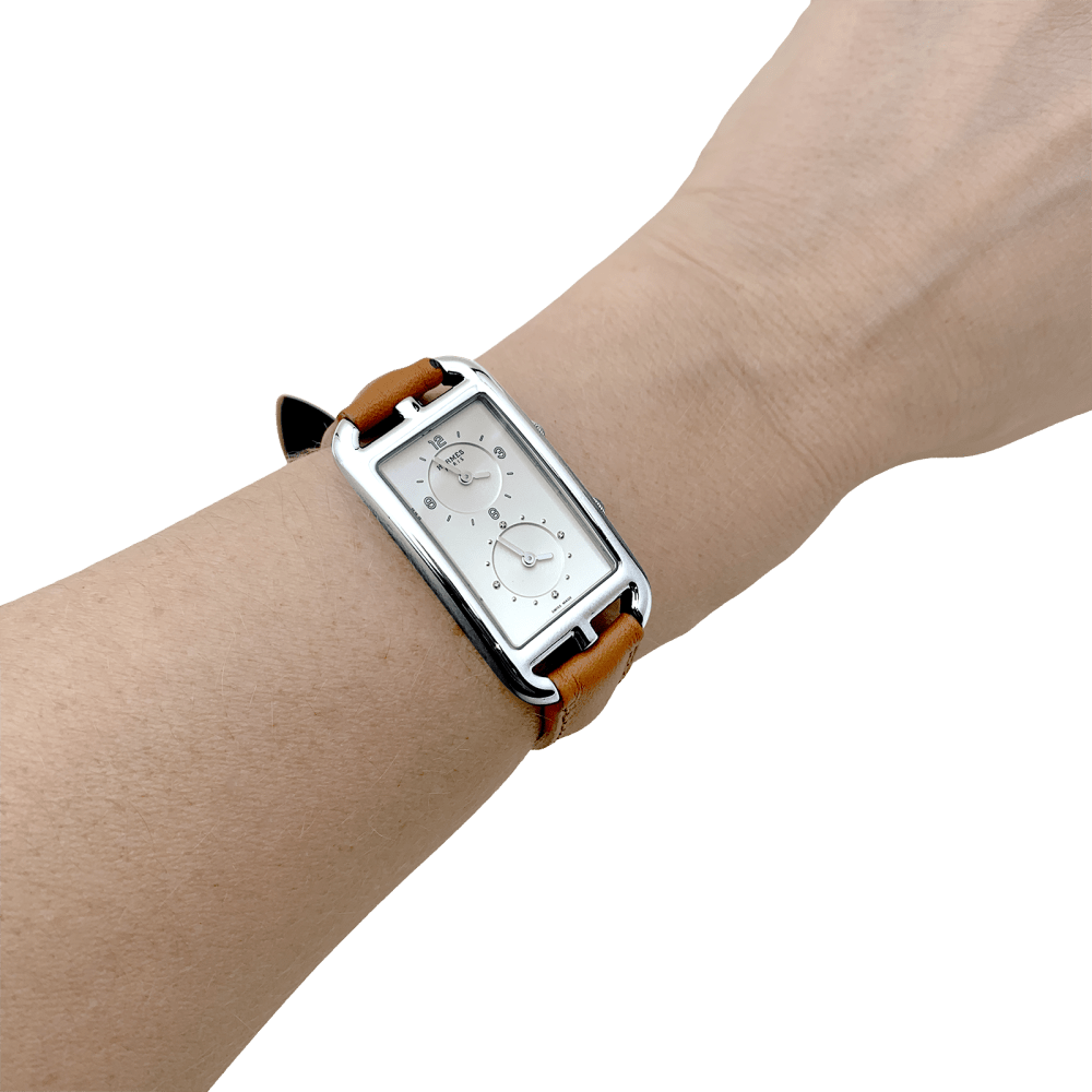 Montre Hermès, "Nantucket Dual Time", acier, cuir, diamants.