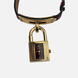 Montre HERMÈS Kelly en métal plaqué or et cuir