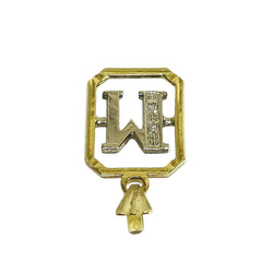 Pendentif “M” en or blanc, or jaune et diamants