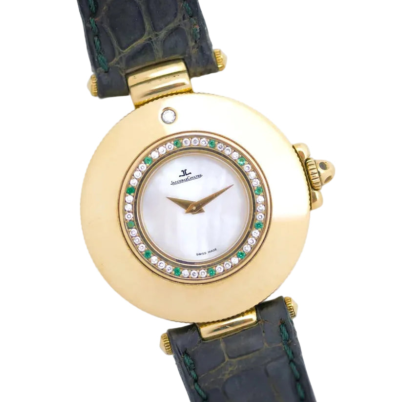 Montre JAEGER-LECOULTRE en or jaune, nacre, cuir, émeraudes et diamants