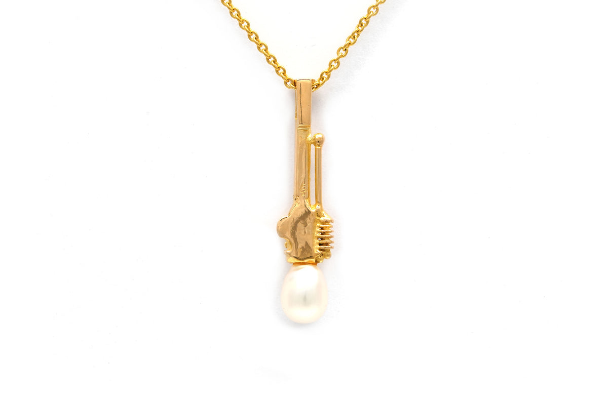 Pendentif en or jaune et perle