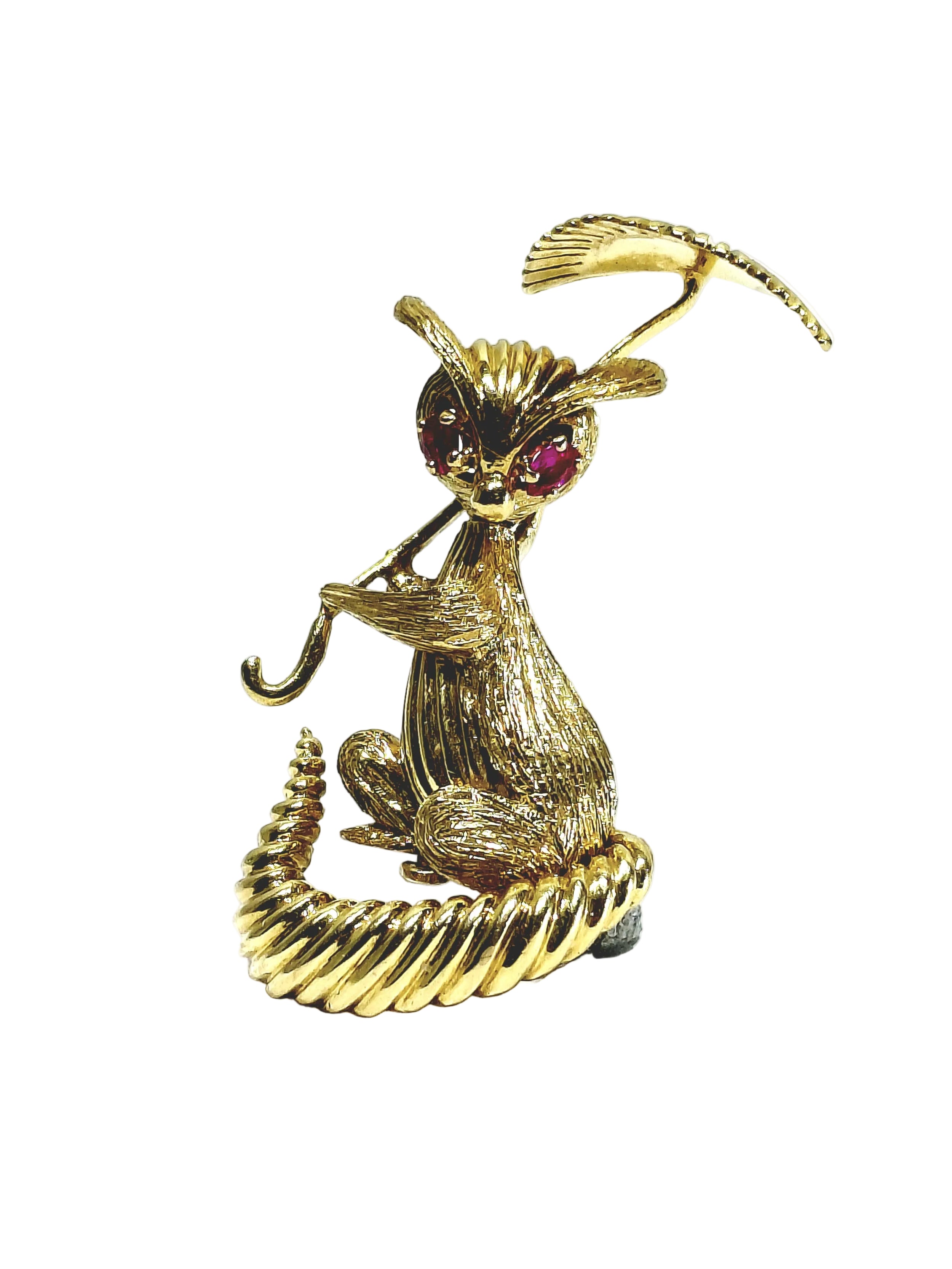 Broche en or champagne et rubis