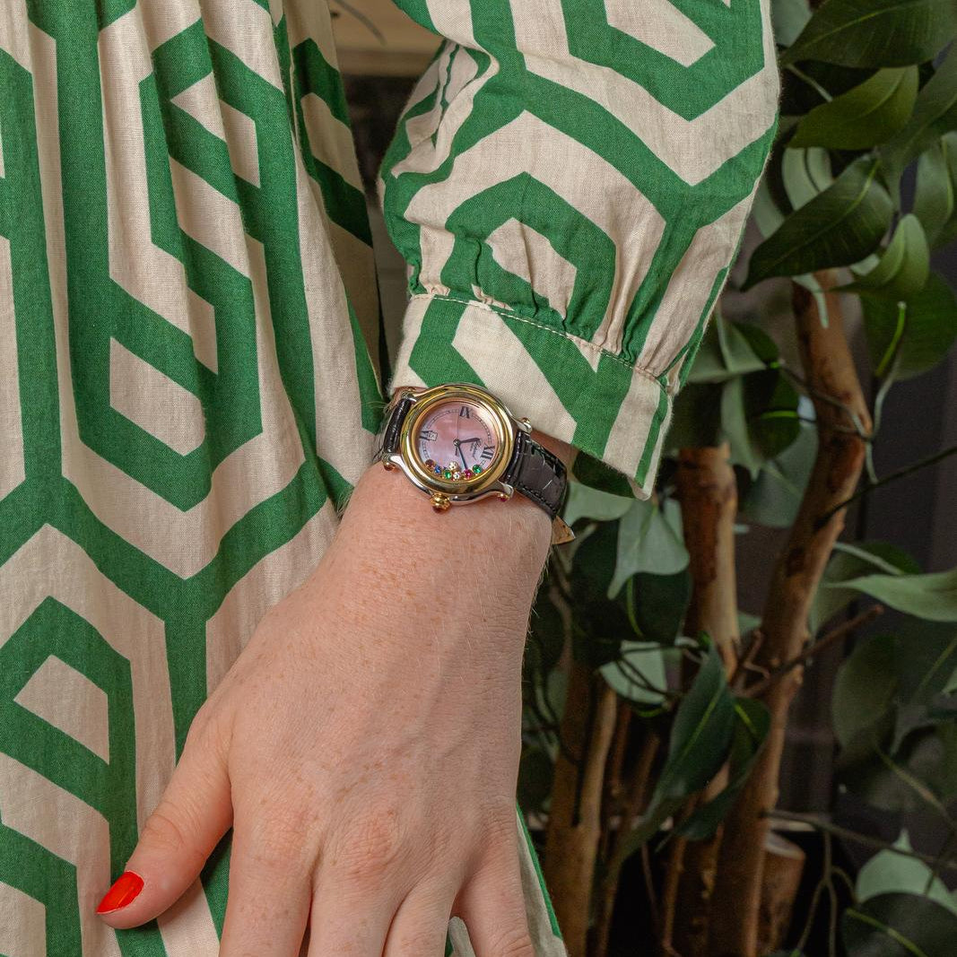 Montre CHOPARD "Happy Sport" en or jaune, acier, nacre, cuir, rubis, émeraudes, saphir et diamants