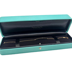 Bracelet TIFFANY & CO. "T" en or jaune et diamants