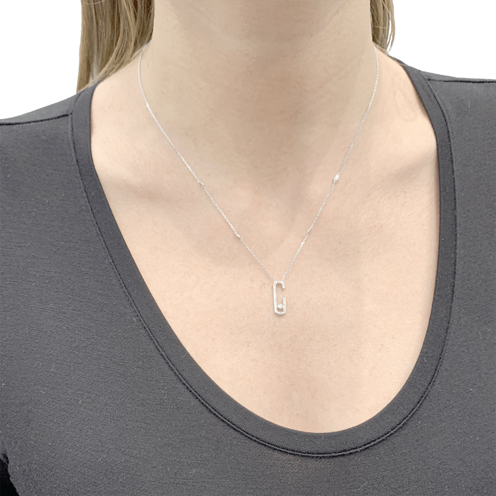 Collier Messika, "Move", or blanc et diamants.