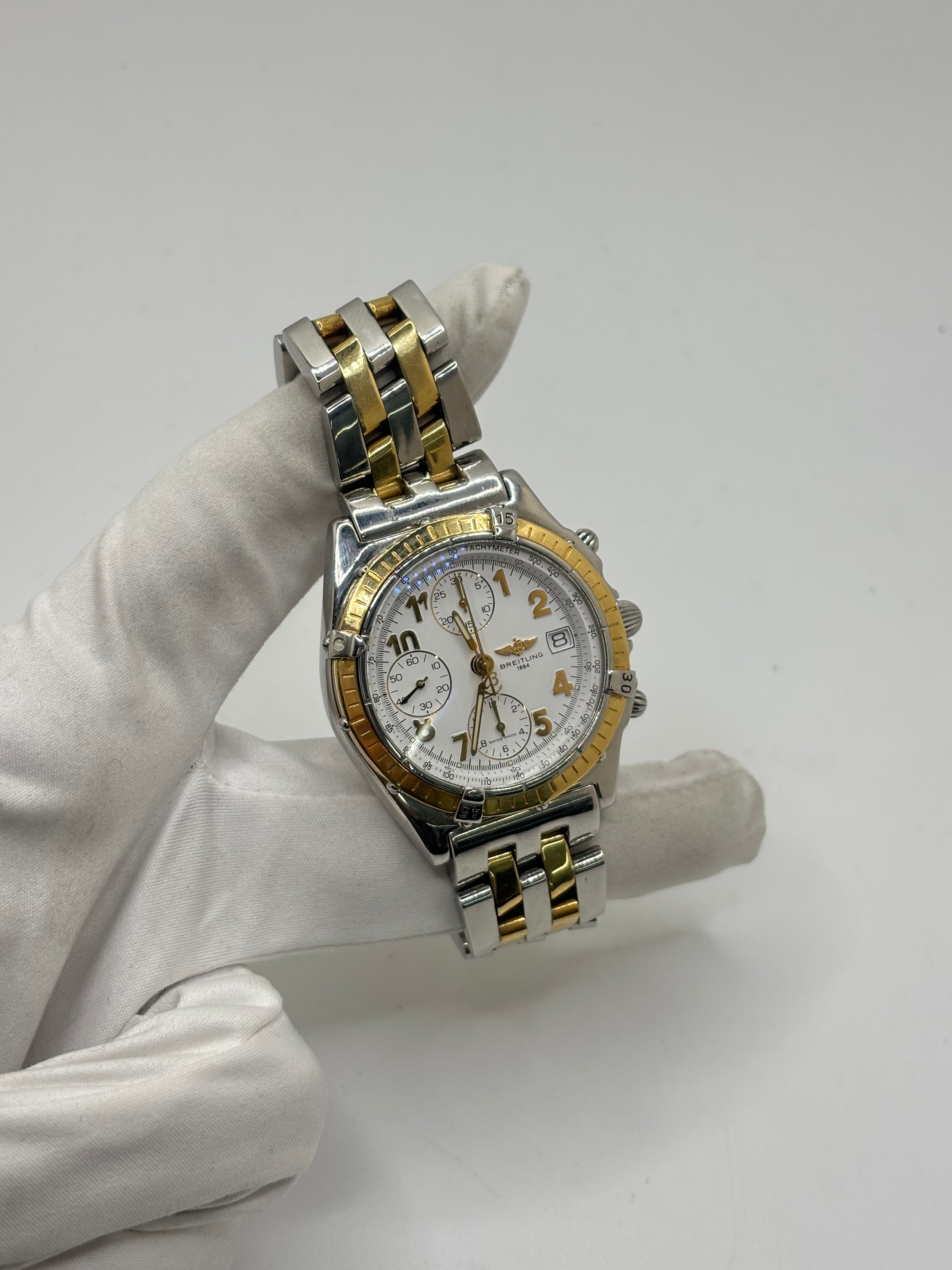 Montre Breitling Chronomat en or et acier