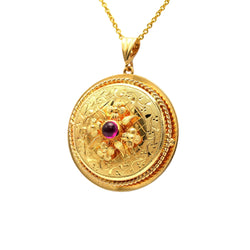 Pendentif en or jaune et rubis