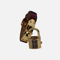 Montre HERMÈS Kelly en métal plaqué or et cuir