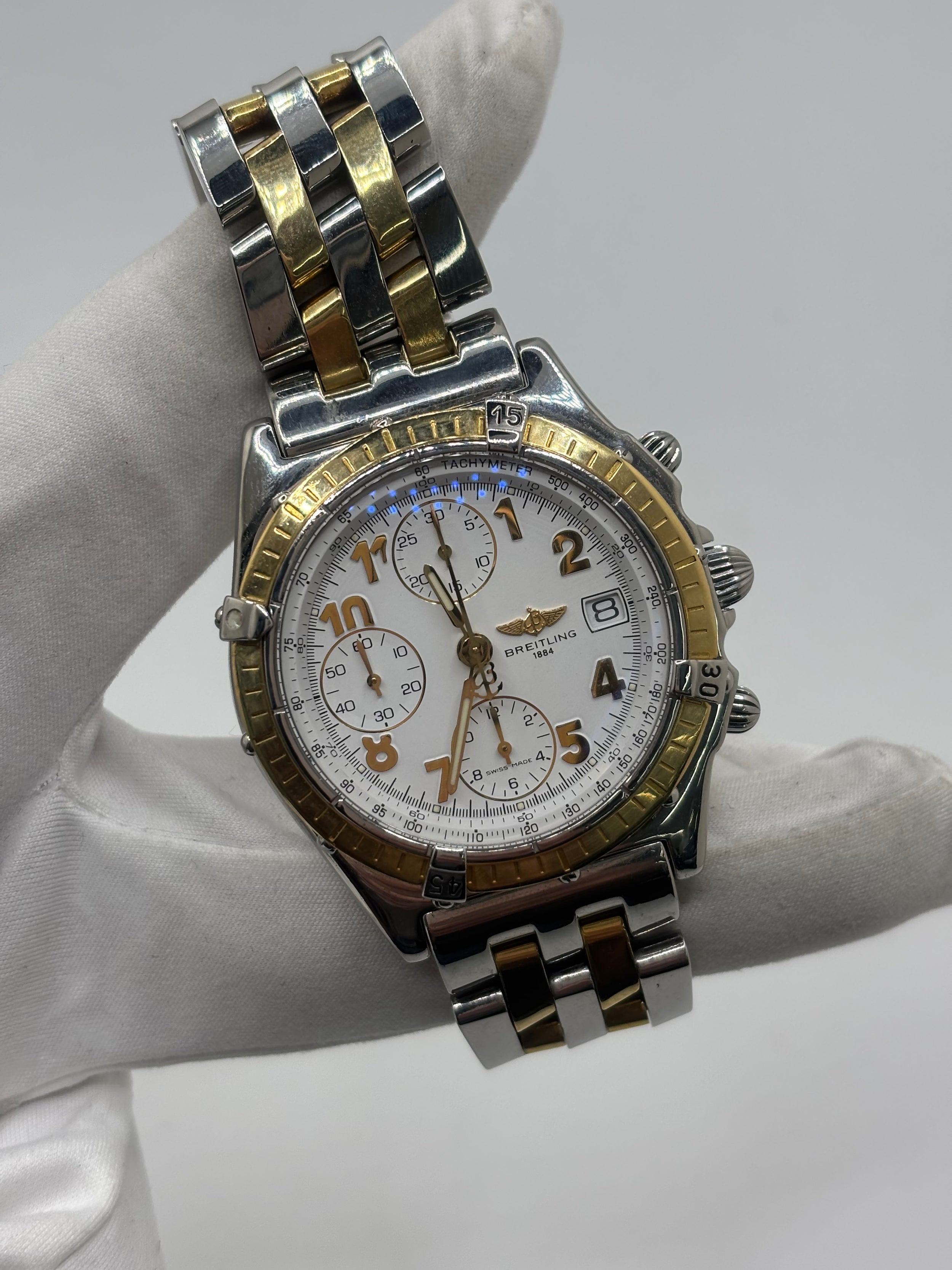 Montre Breitling Chronomat en or et acier