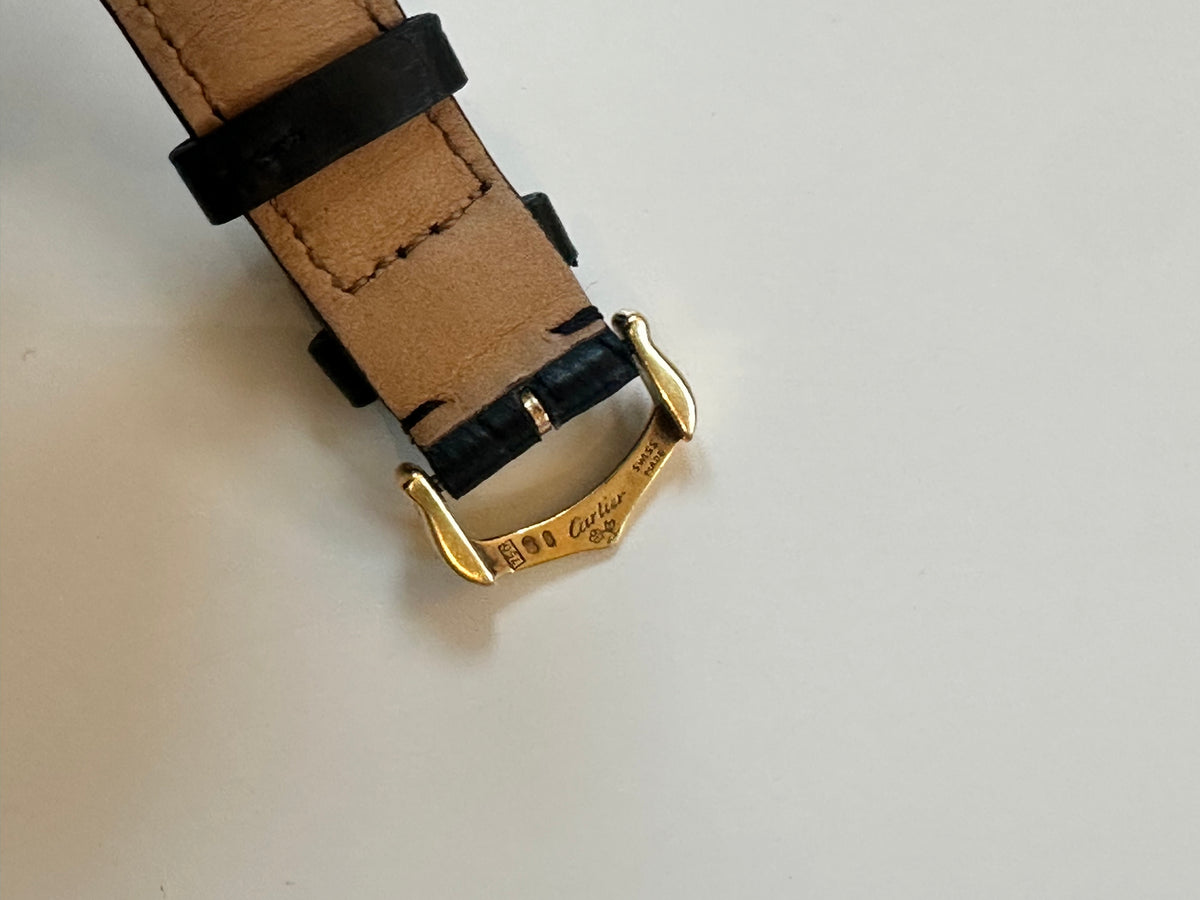 Montre CARTIER Tank Louis en or jaune, cuir et quartz