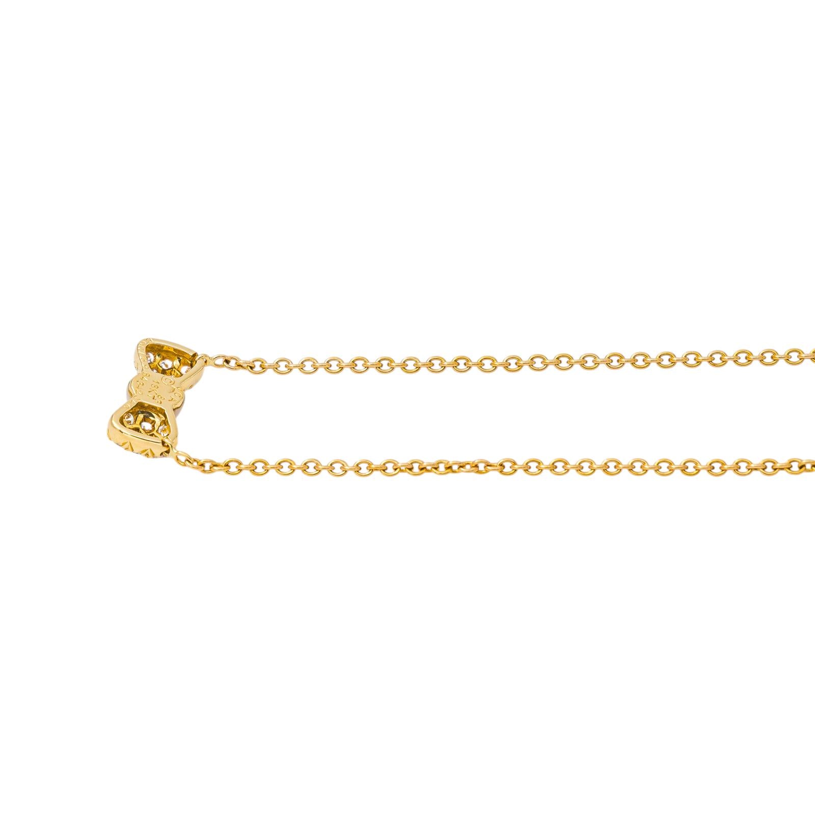 Collier Pendentif VAN CLEEF & ARPELS "Noeud" en or jaune, corail et diamants