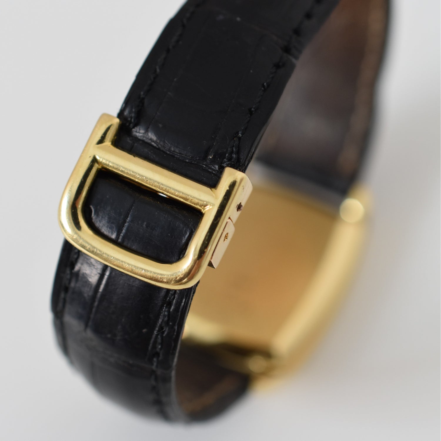 Montre BAUME & MERCIER pour VAN CLEEF & ARPELS en or jaune, cuir et saphir