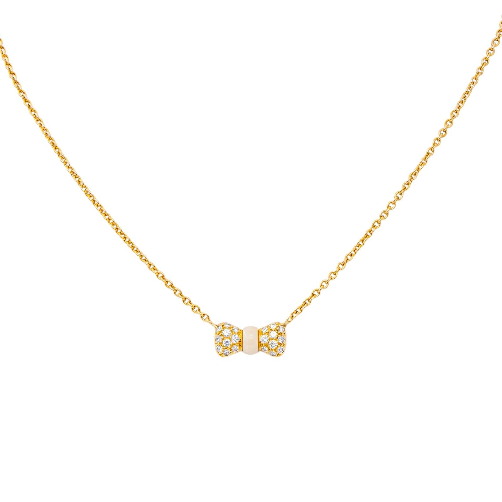 Collier Pendentif VAN CLEEF & ARPELS "Noeud" en or jaune, corail et diamants