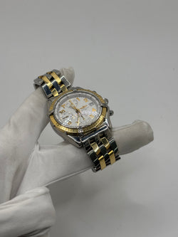Montre Breitling Chronomat en or et acier
