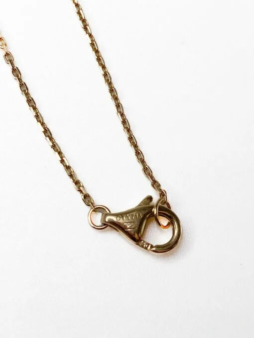 Collier Pendentif CARTIER "Amulette" en or blanc, nacre et diamant