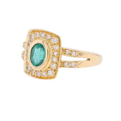 Bague Entourage en or jaune, émeraude et diamants