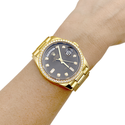 Montre Rolex, "Oyster Perpetual Day-Date", or jaune, diamants.