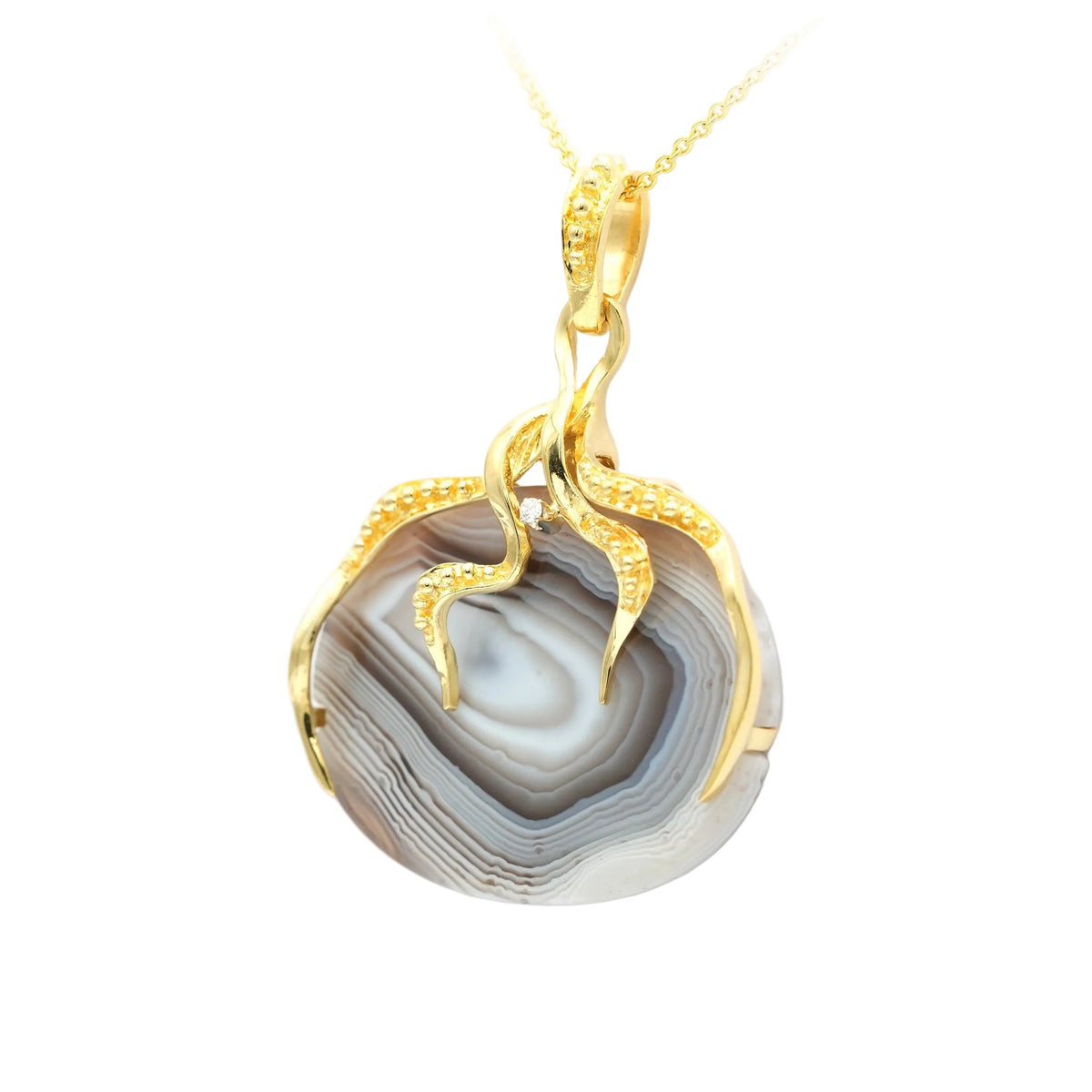 Pendentif en or jaune, agate et diamant