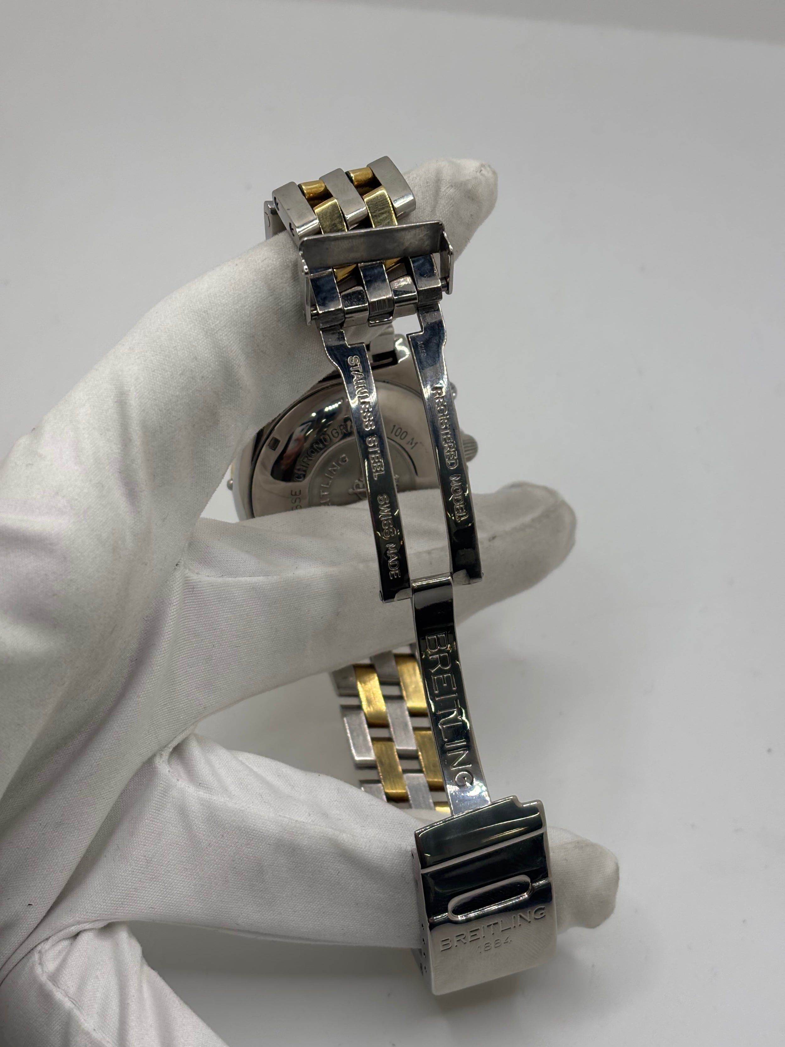 Montre Breitling Chronomat en or et acier