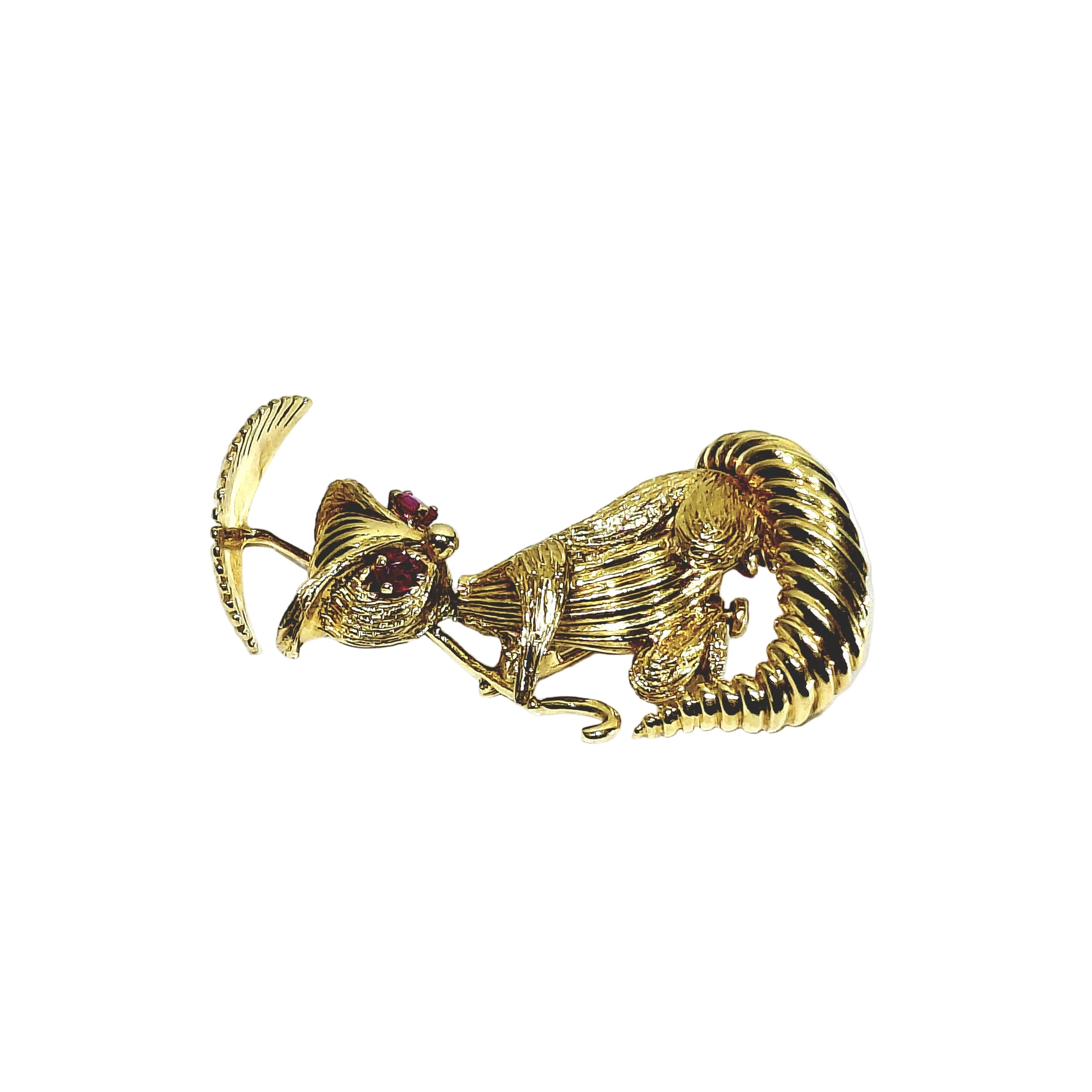 Broche en or champagne et rubis