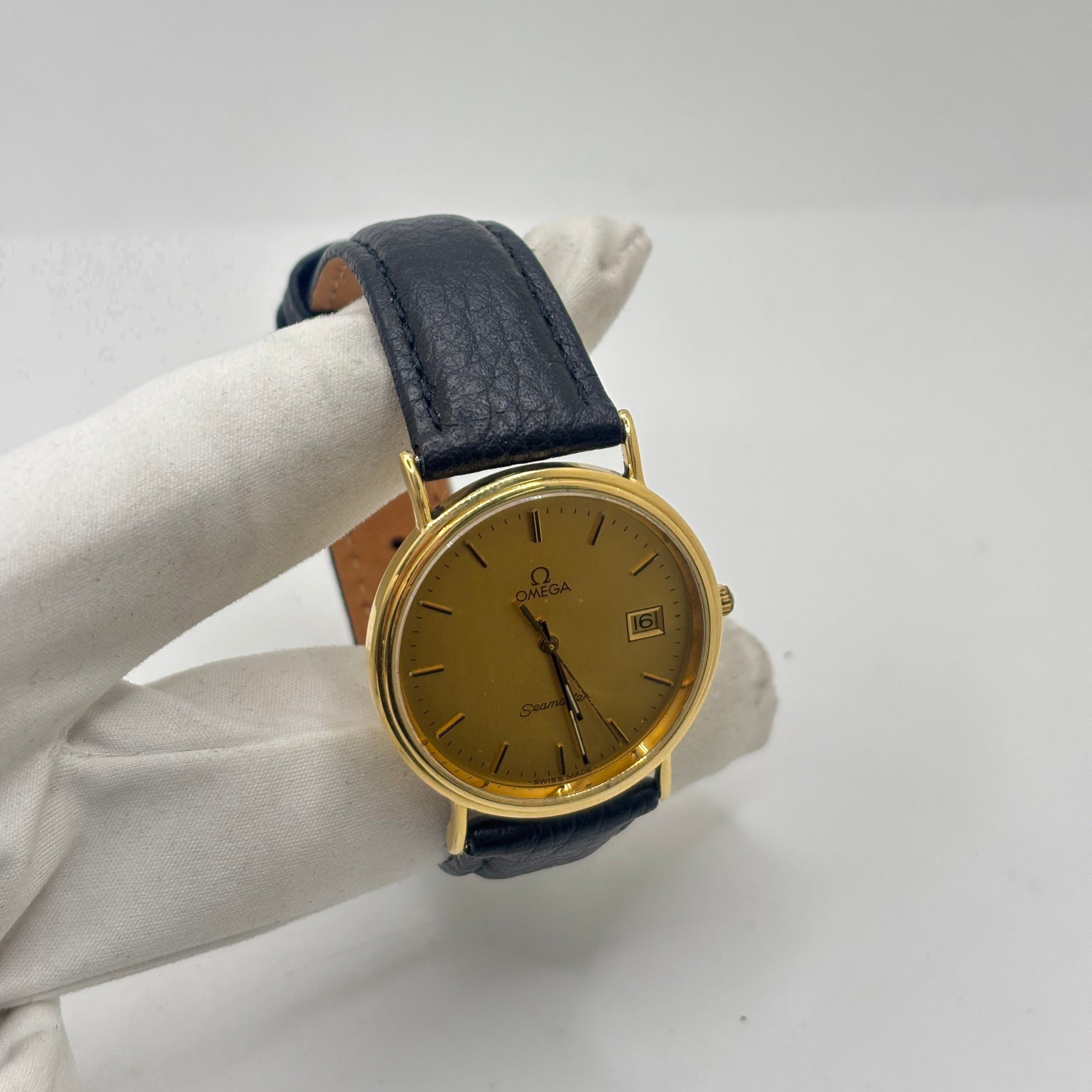 Montre OMEGA "Seamaster" en or jaune et cuir