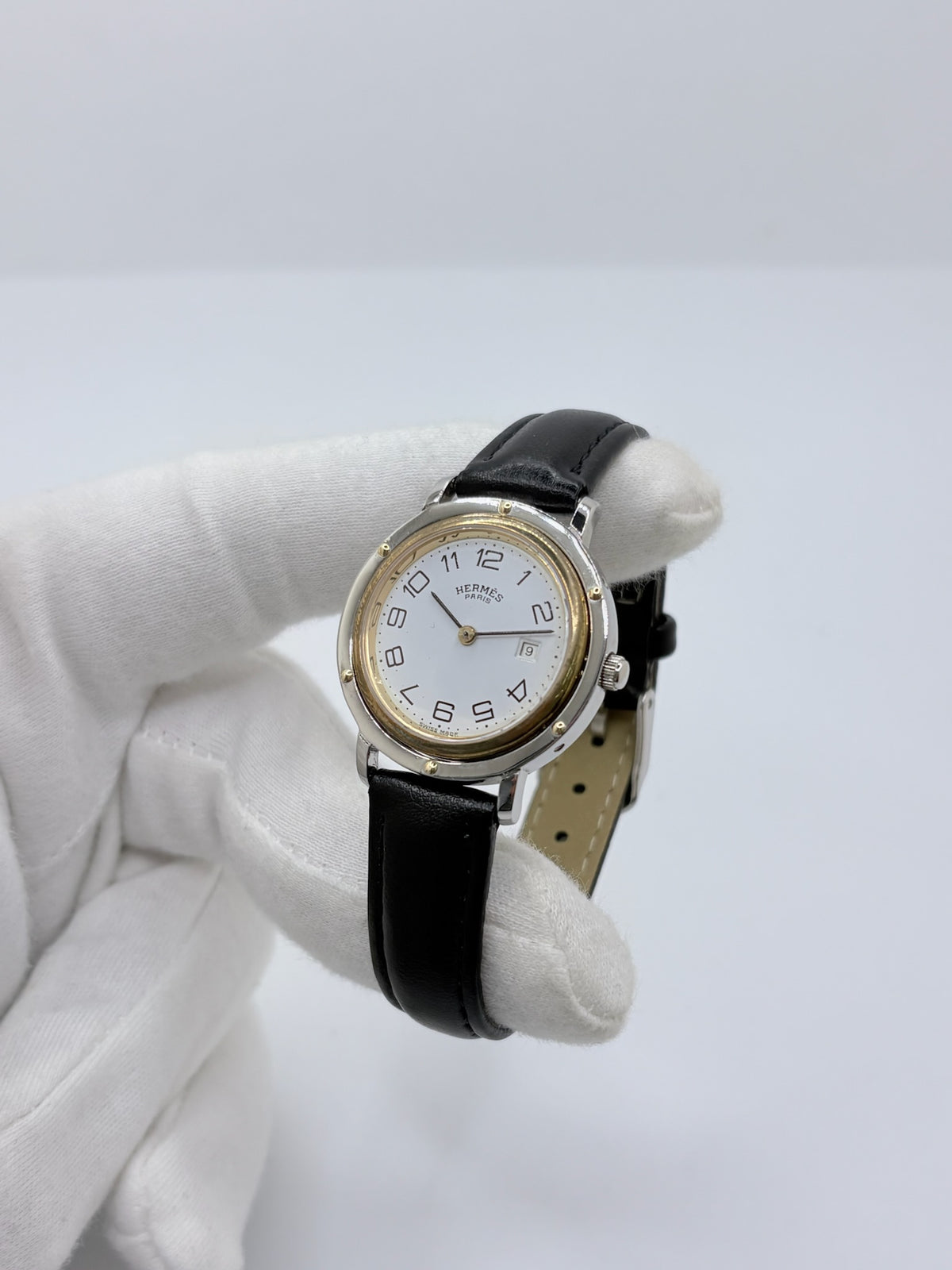 Montre HERMÈS Clipper en or jaune, acier et cuir