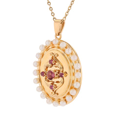 Pendentif en or jaune, perles et grenats