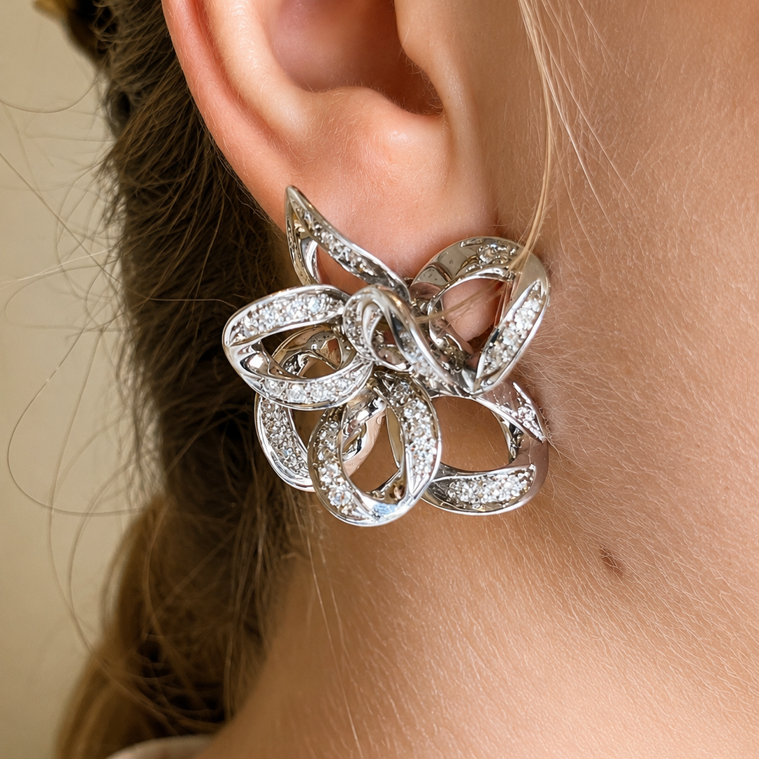 Boucles d'oreilles Puces POMELLATO en or blanc et diamants
