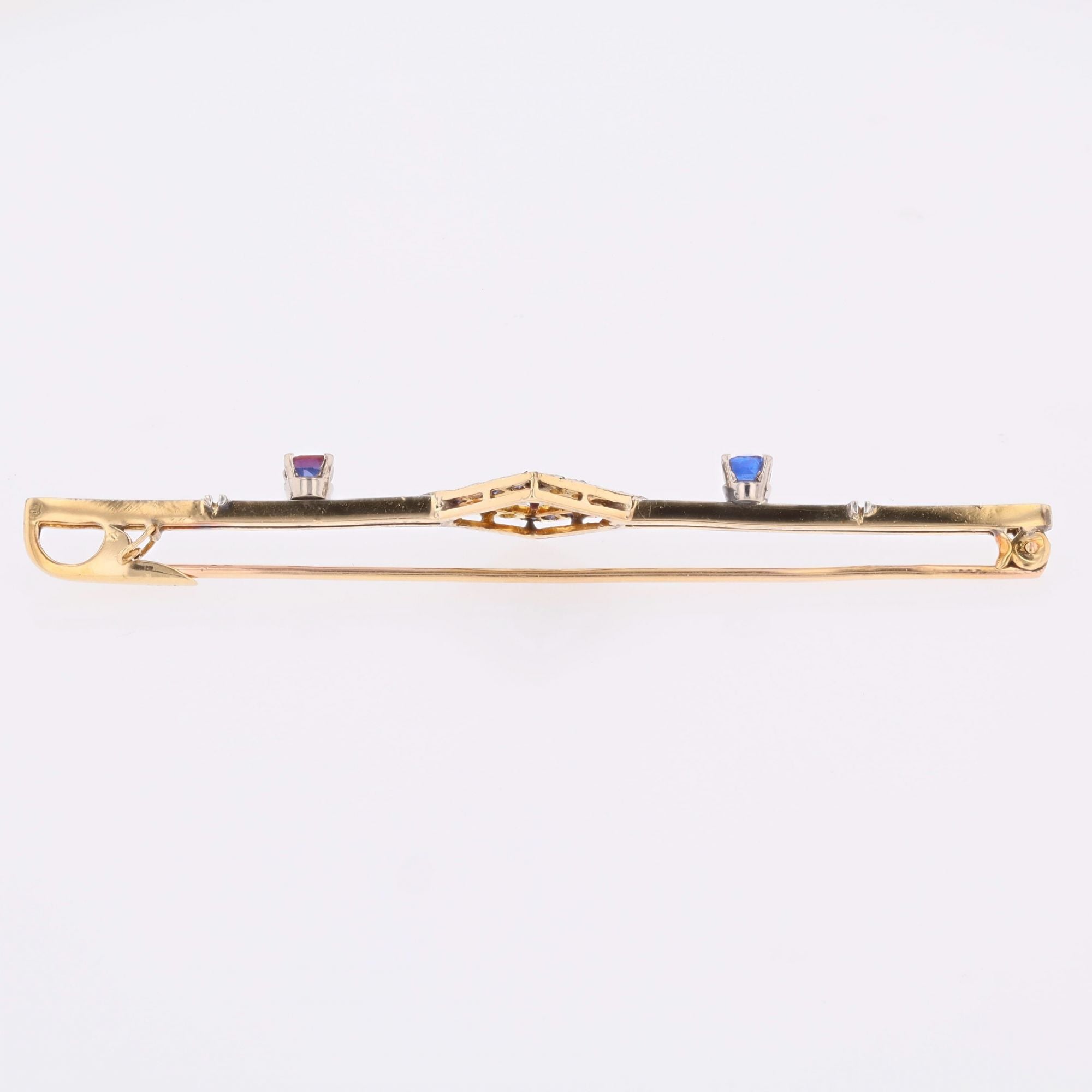 Broche Barrette en or jaune, platine, saphirs et diamants