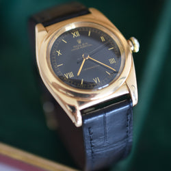 Montre ROLEX "Oyster Perpetual Bubbleback Ovetto" en or jaune et cuir