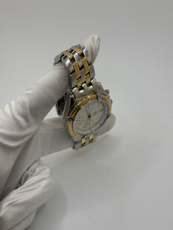 Montre Breitling Chronomat en or et acier