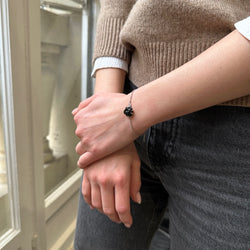 CHANEL Camélia bracelet in white gold, onyx and diamonds