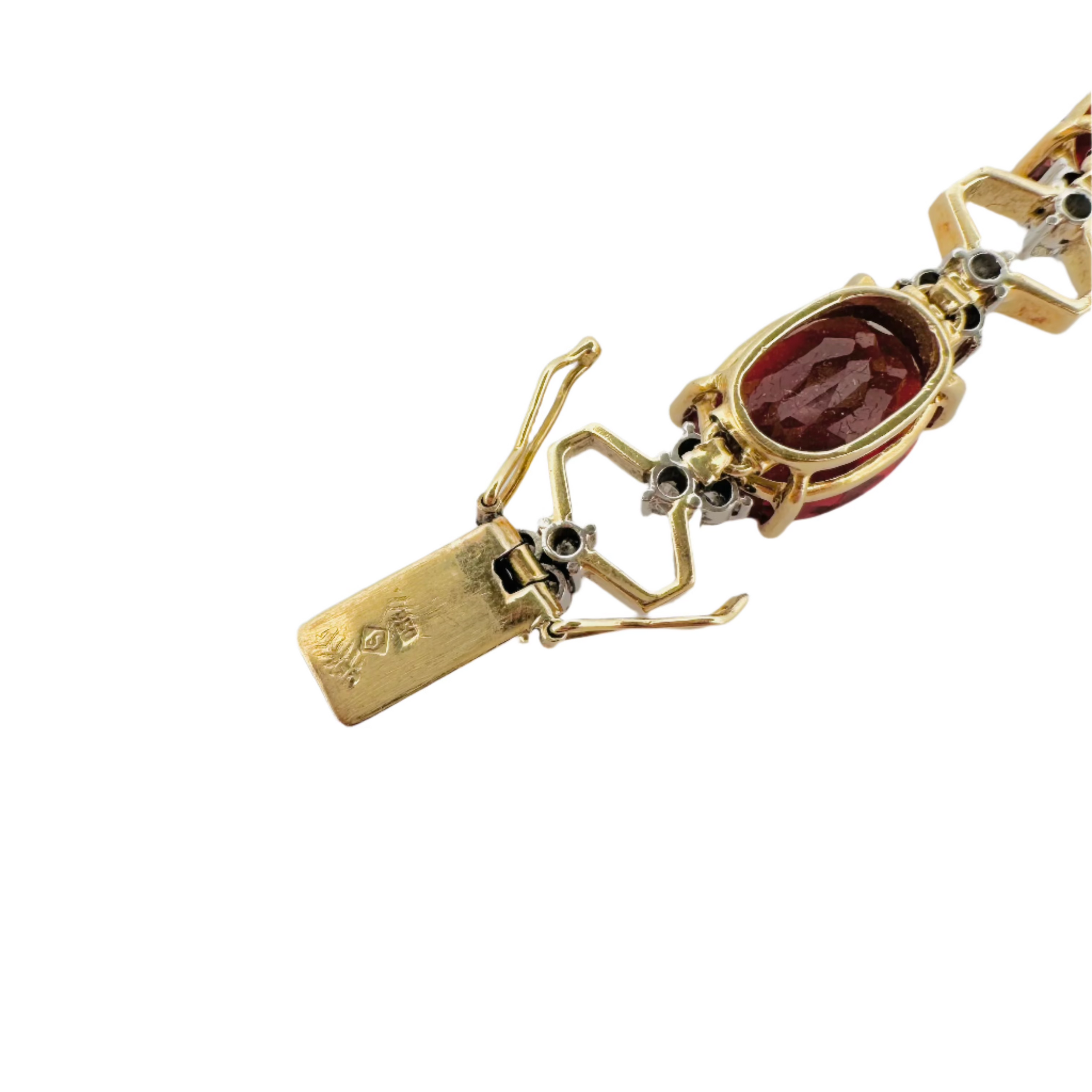 Articulated bracelet in yellow gold, platinum, garnets and diamonds