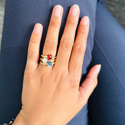 Bague POMELLATO "M’ama non M’ama" en or rose et topaze bleue