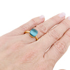 Bague Pomellato, "Nudo Petit", or rose, or blanc, topaze bleue.