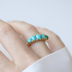Bague Jarretière en or jaune, turquoises et diamants