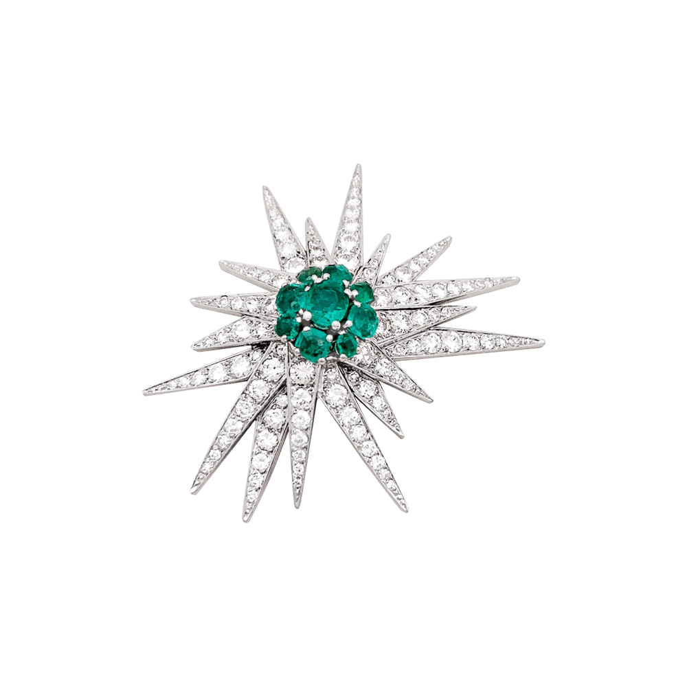 Broche "Étoile", or blanc, platine, émeraudes et diamants.
