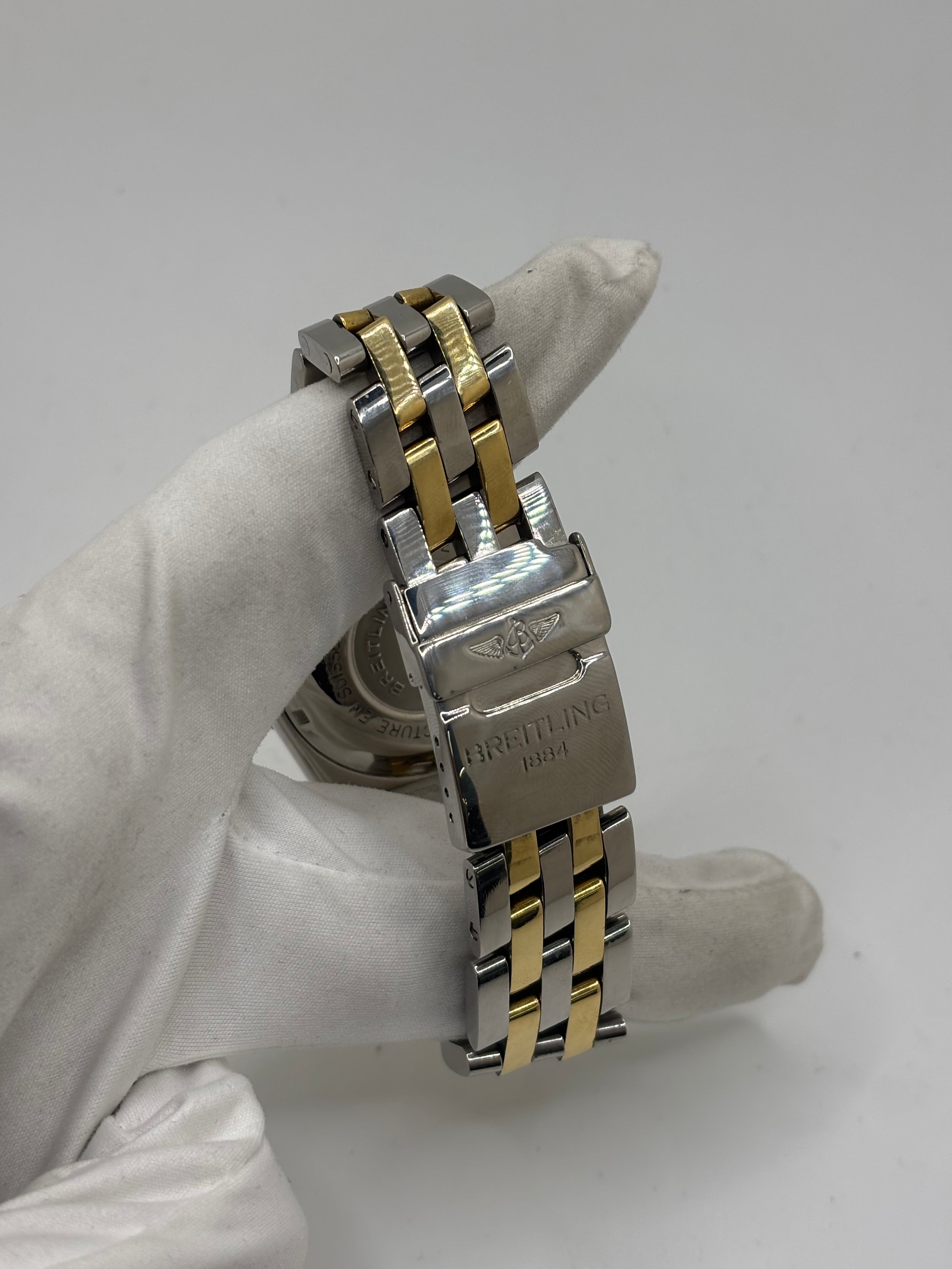 Montre Breitling Chronomat en or et acier
