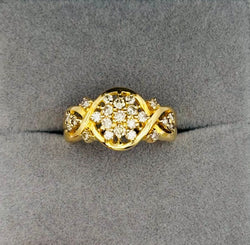 ANILLO DE ORO AMARILLO Y DIAMANTES , DISPUESTOS EN UN PATRÓN FLORAL O ESTRELLADO - Castafiore