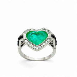 ANILLO EN ORO CON UNA ESMERALDA,DIAMANTES Y ONIX.