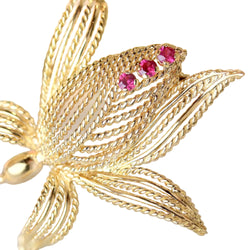 Broche Épingle en or jaune et rubis