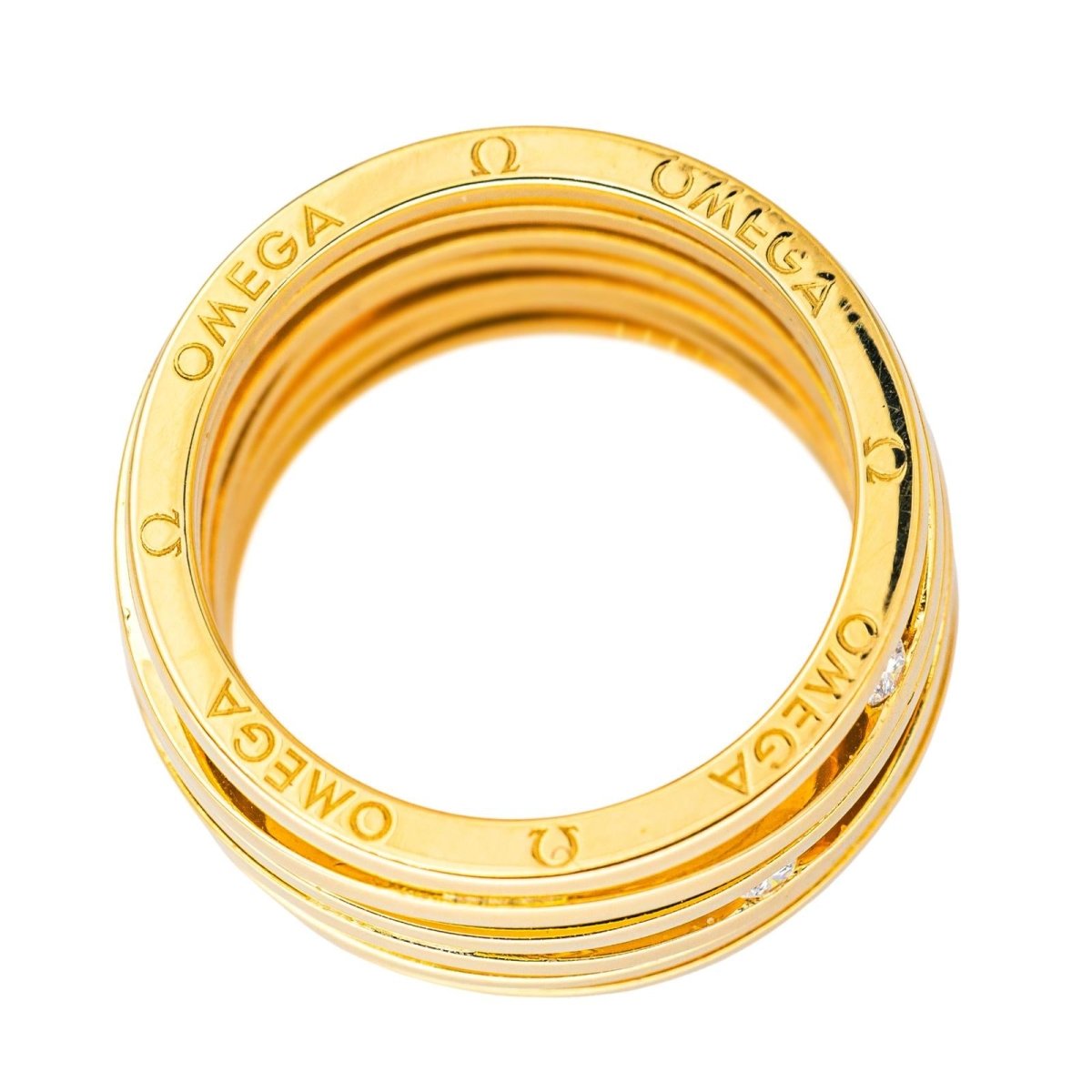 Bague Bandeau OMEGA "Ladymatic" en or jaune et diamants - Castafiore