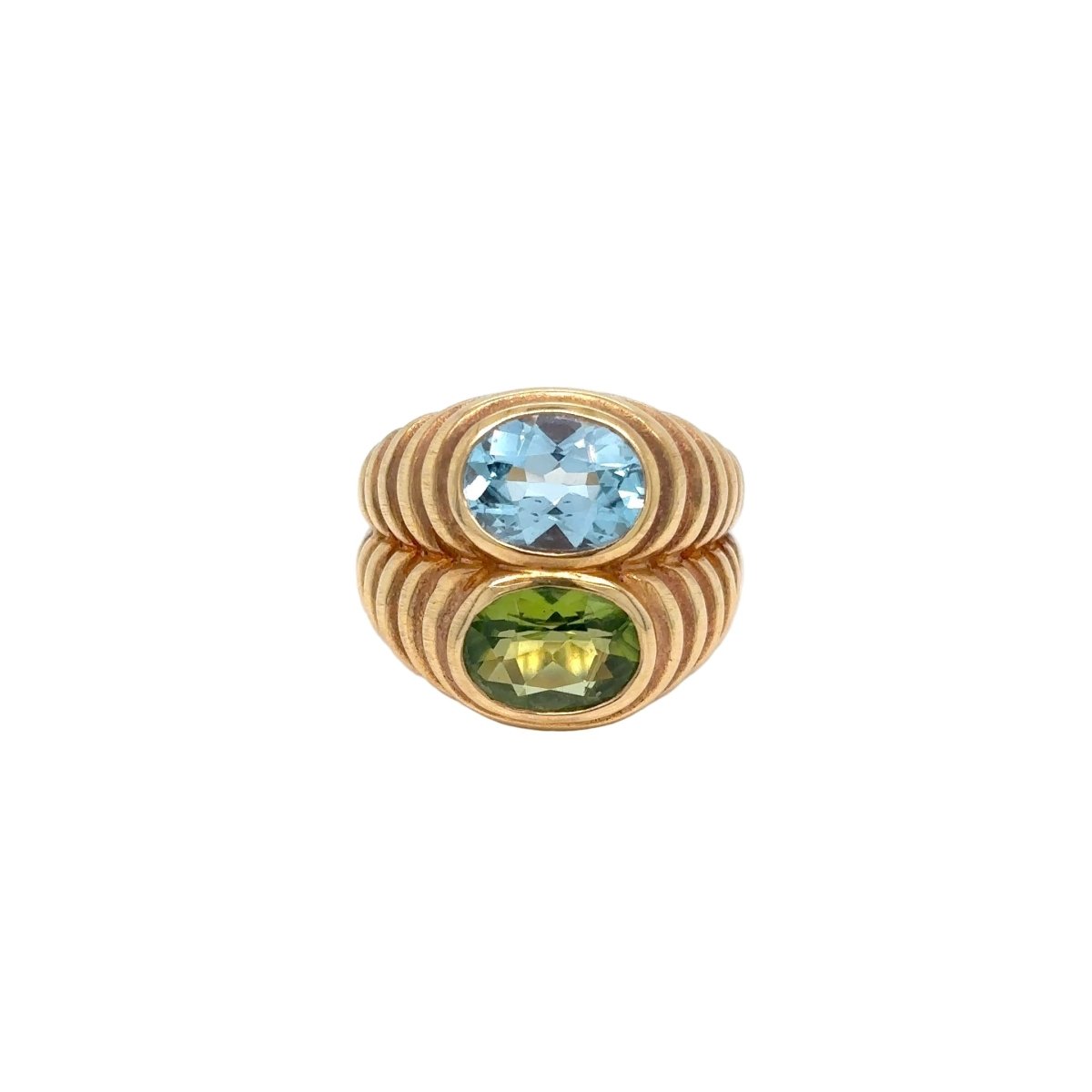 Bague BULGARI Doppio baccellato en or jaune topaze bleue et péridot - Castafiore