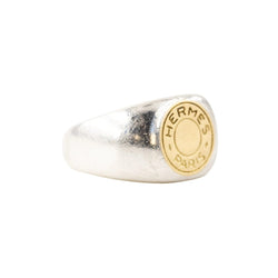 Bague Chevalière HERMÈS "Clou de selle" en argent et or jaune - Castafiore