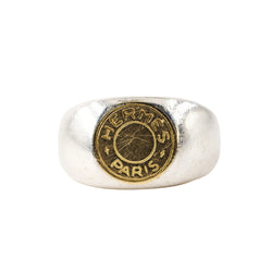 Bague Chevalière HERMÈS "Clou de selle" en argent et or jaune - Castafiore