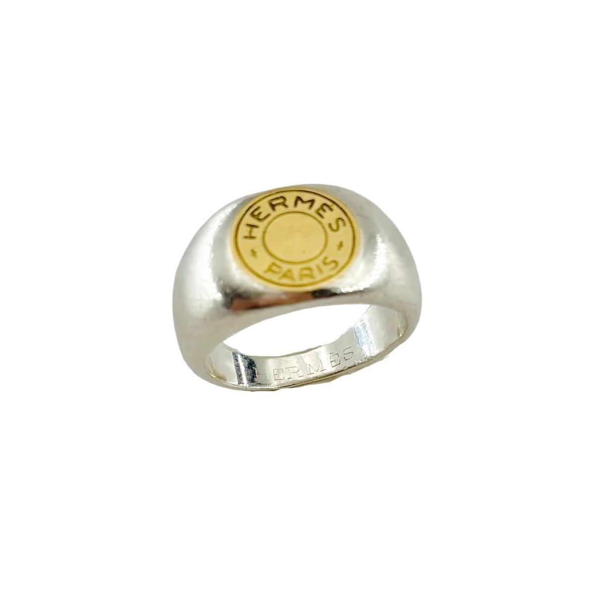 Bague Chevalière HERMÈS "Clou de selle" en argent et or jaune - Castafiore