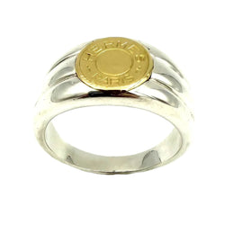 Bague Chevalière HERMÈS "Clou de selle" en or jaune et argent - Castafiore