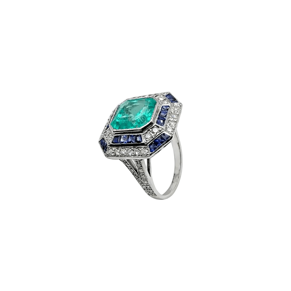 Bague Cocktail en or blanc, émeraude, saphirs et diamants - Castafiore